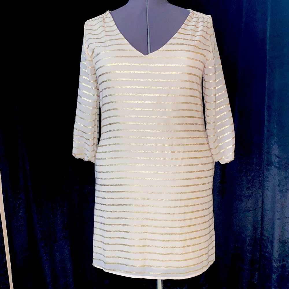 Women’s cream and gold long sleeve midi dress.